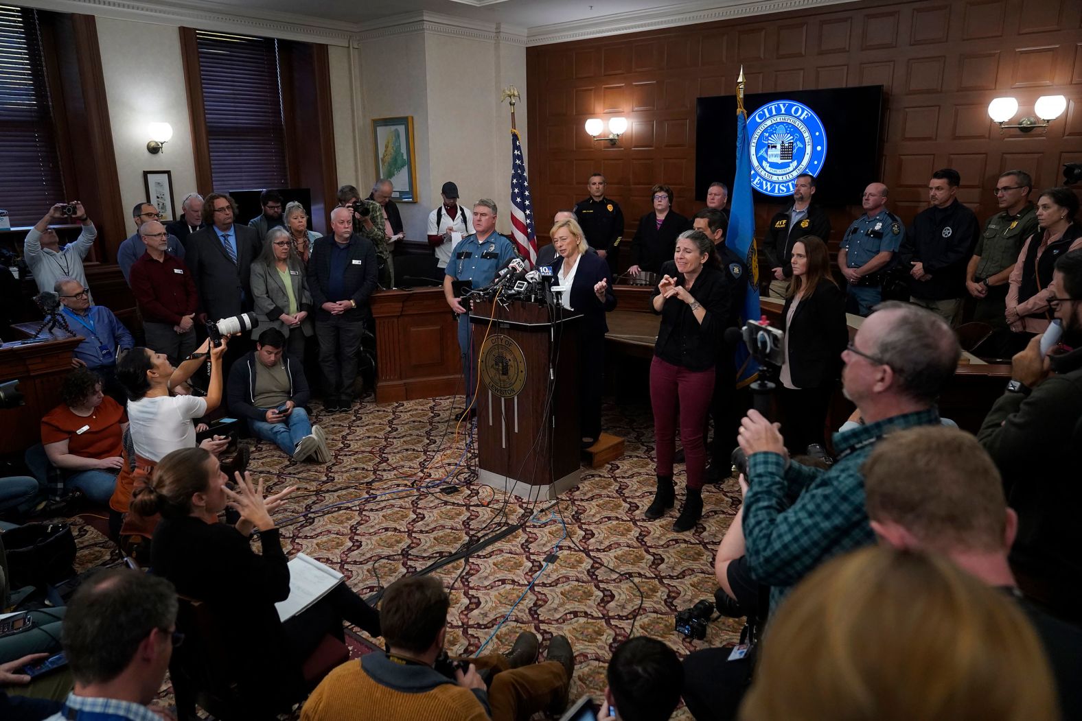 Maine Gov. Janet Mills, center, speaks during a news conference at Lewiston City Hall on Thursday.
