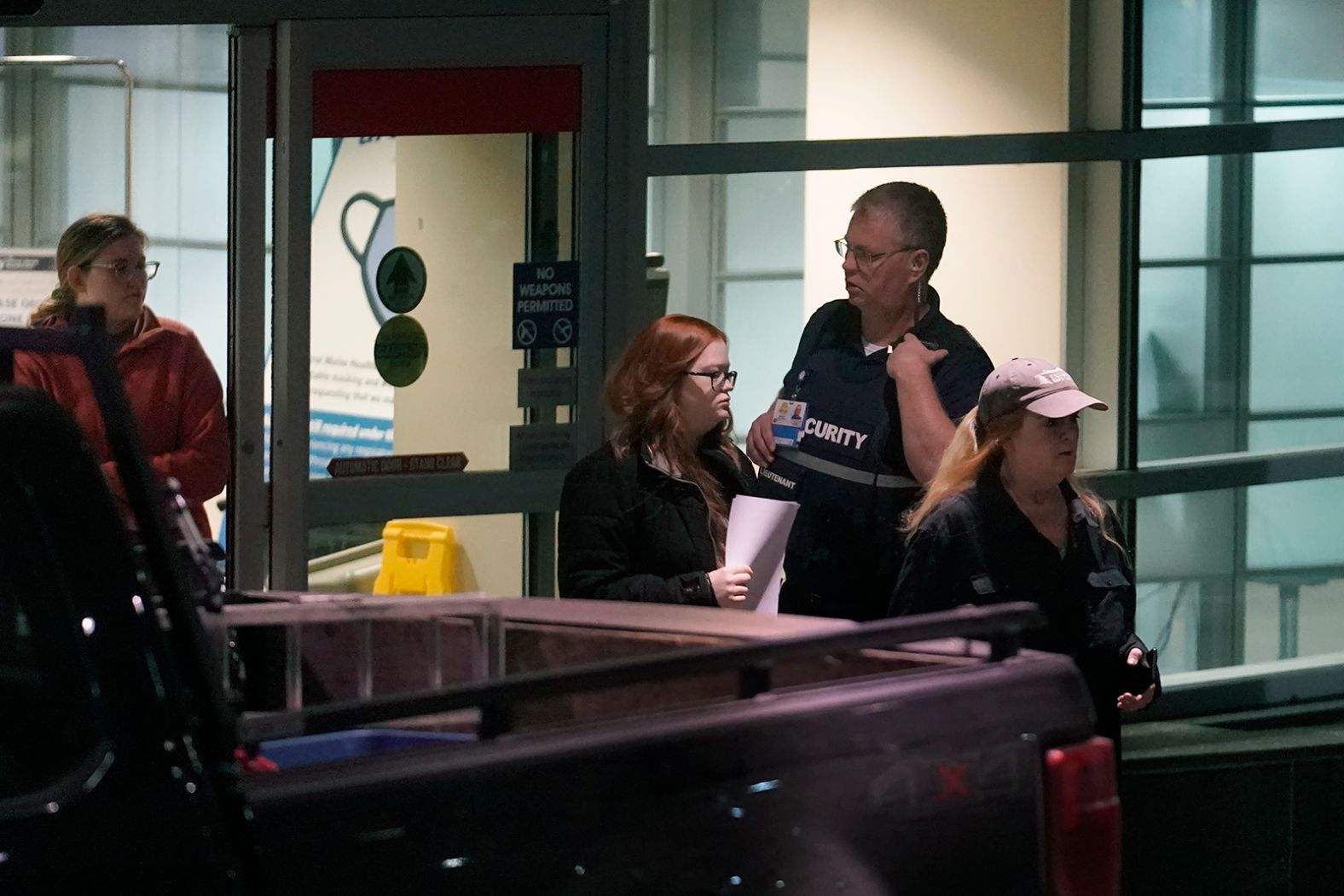 People depart an emergency room entrance at the Central Maine Medical Center.