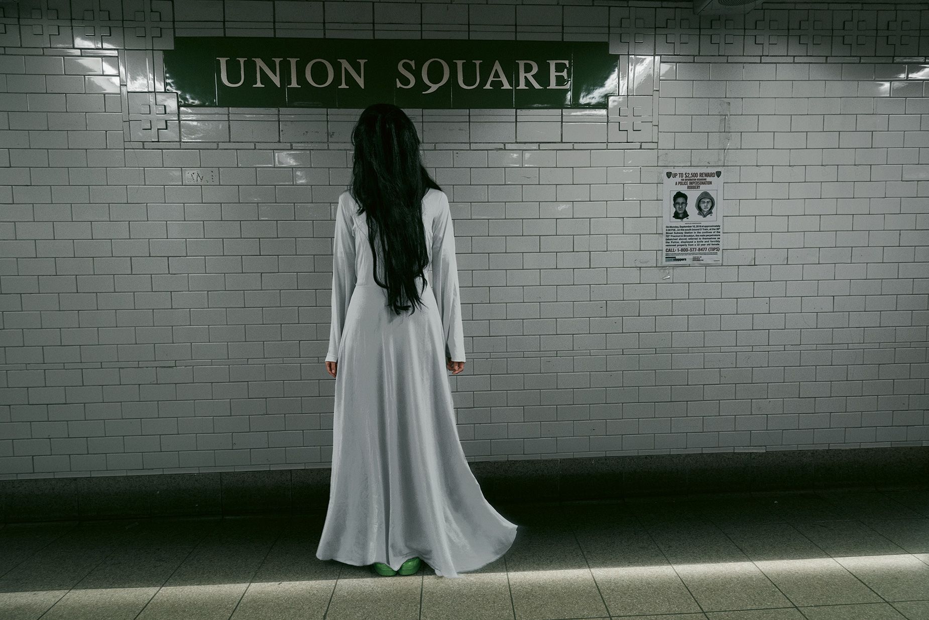 Samara from “The Ring” waits for her train at Union Square.