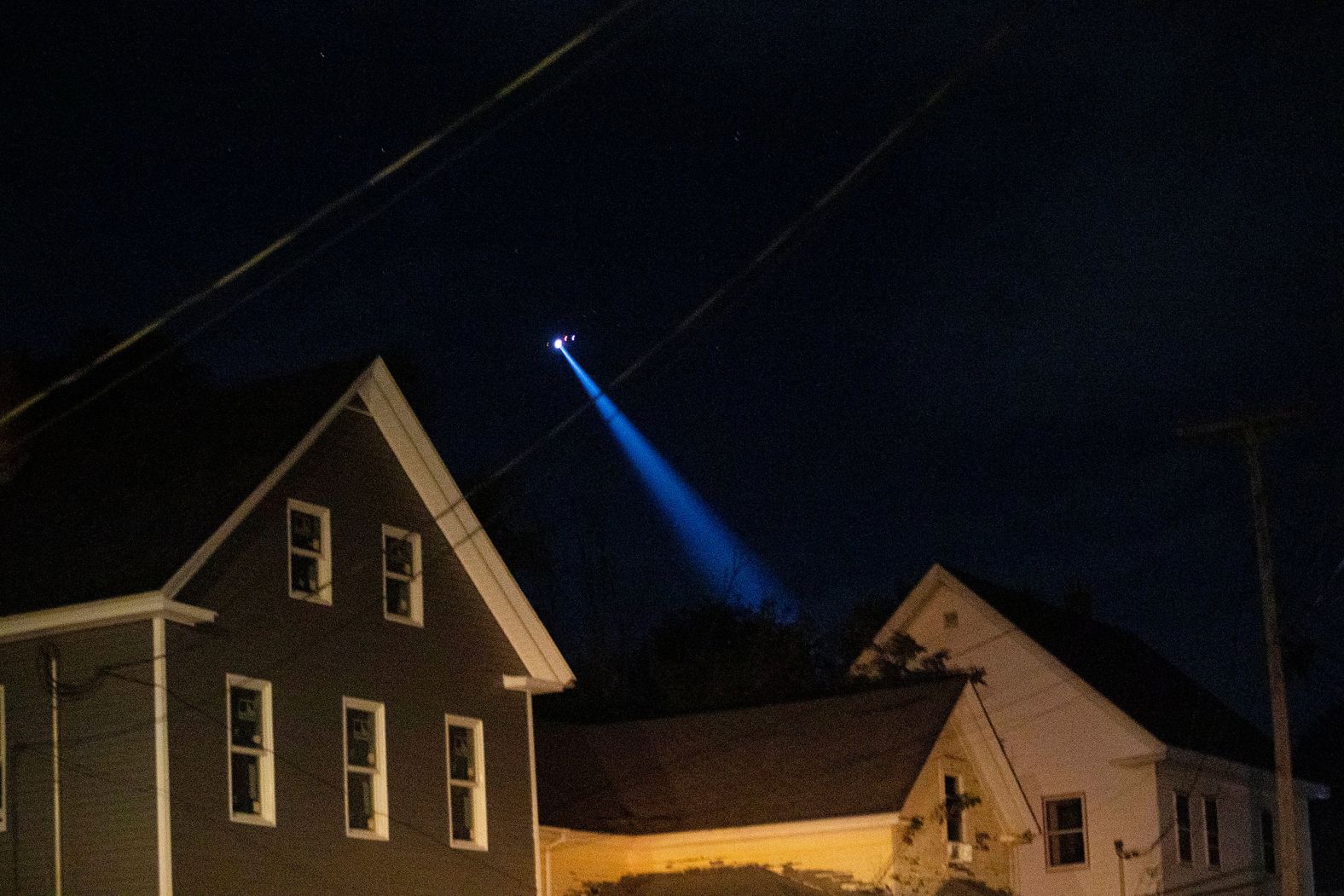 A helicopter searches an area of Lewiston on Wednesday.