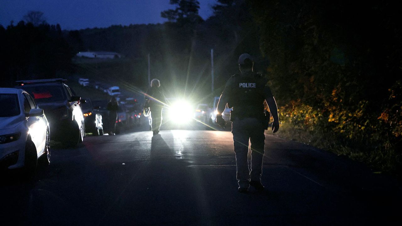 Law enforcement members search for a suspect, following a deadly mass shooting in Lewiston, in Bowdoin, Maine, U.S. October 26, 2023.  REUTERS/Shannon Stapleton