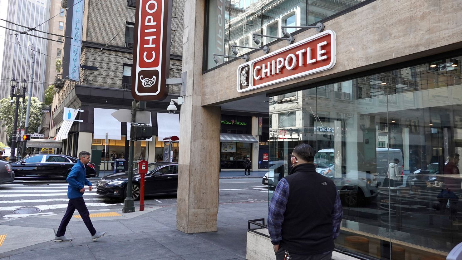 SAN FRANCISCO, CALIFORNIA - APRIL 26: Pedestrians walk by a Chipotle restaurant on April 26, 2022 in San Francisco, California. Chipotle Mexican Grill will report its first quarter earnings today after the closing bell. (Photo by Justin Sullivan/Getty Images)