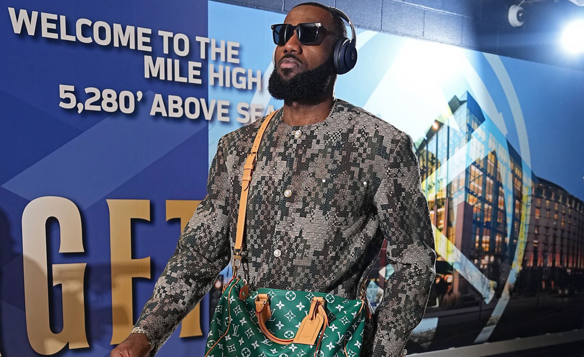 LeBron James was seen wearing a Louis Vuitton Speedy bag at the first Lakers game of the season.