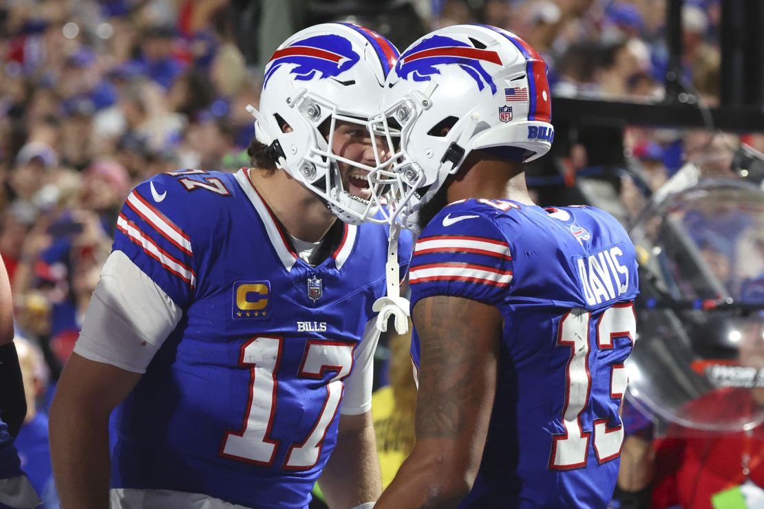 Buffalo Bills quarterback Josh Allen (17) celebrates his touchdown pass to wide receiver Gabe Davis (13) in the second half of an NFL football game against the Tampa Bay Buccaneers, Thursday, Oct. 26, 2023, in Orchard Park, N.Y. (AP Photo/Jeffrey T. Barnes)