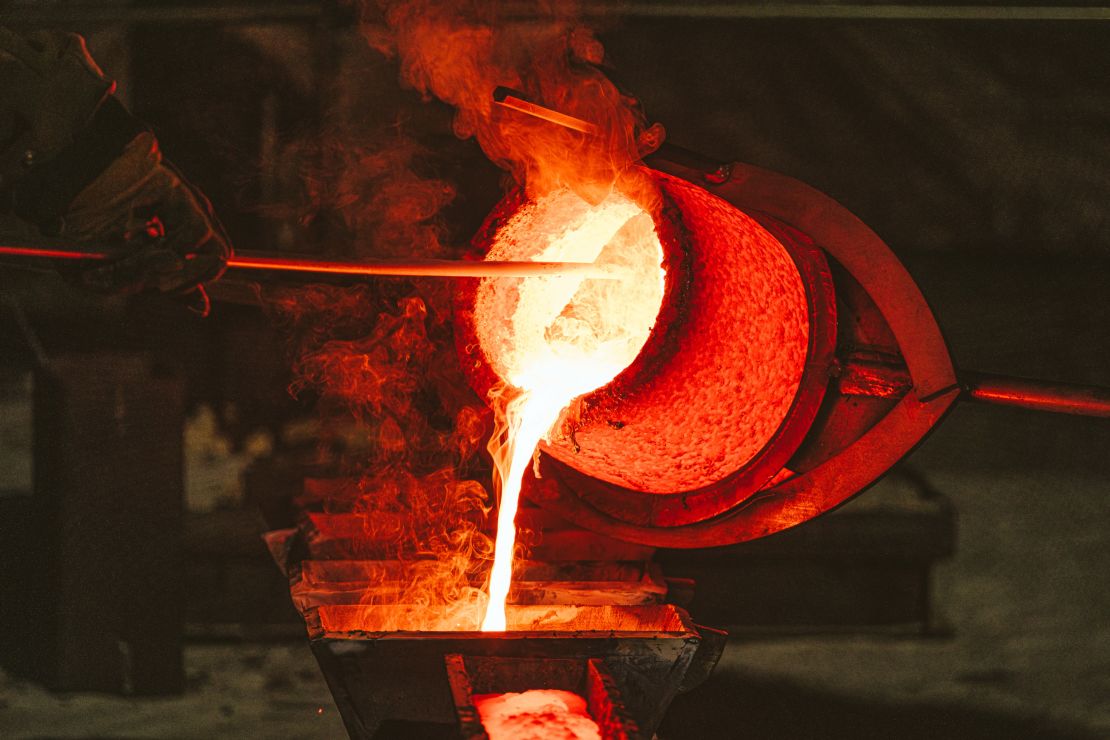 Molten bronze produced by melting Charlottesville's monument of Robert E. Lee is poured from a hot crucible into ingot molds. October 21, 2023. Photo by Eze Amos