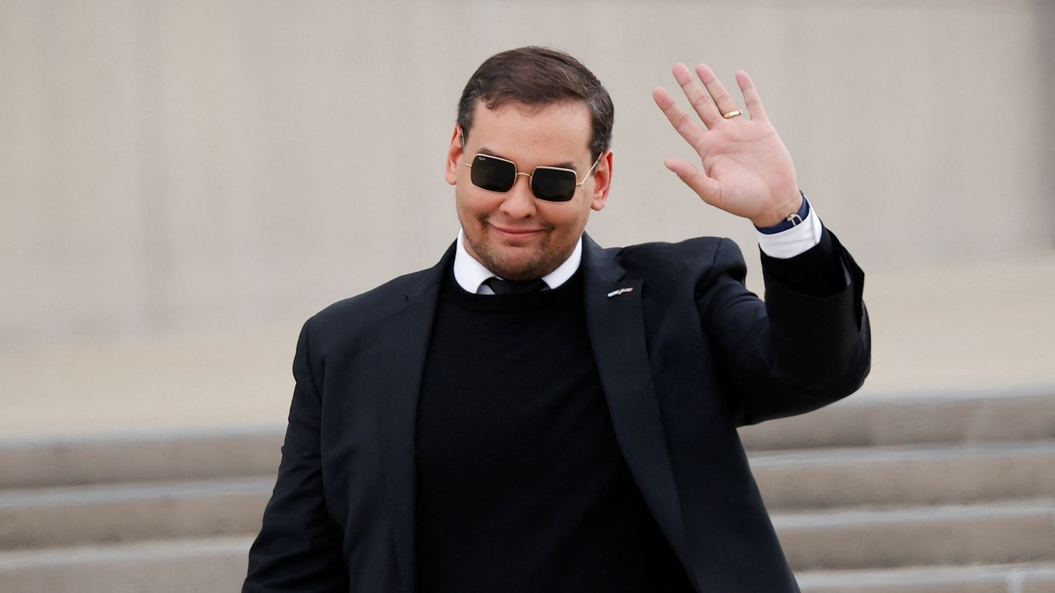 U.S. Representative George Santos (R-NY) gestures, as he walks outside the Central Islip Federal Courthouse on the day of his hearing, in Central Islip, New York, U.S., October 27, 2023.