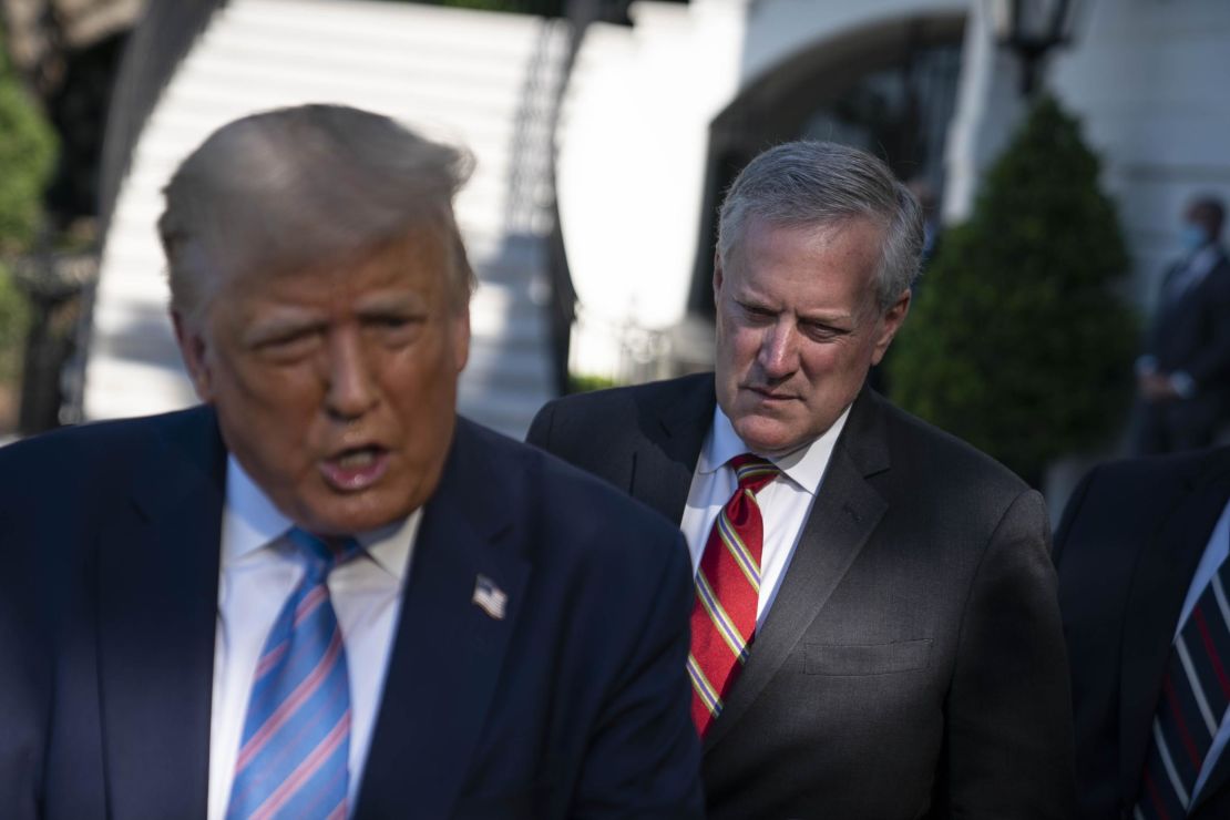 Mark Meadows, White House chief of staff, listens as U.S. President Donald Trump, left, speaks to members of the media before boarding Marine One on the South Lawn of the White House in Washington, D.C., U.S., on Wednesday, July 29, 2020. Trump will look to deep-pocketed energy barons to help jump start his sputtering re-election campaign today during a stop in Texas, a traditional Republican bastion that has become increasingly competitive for Democrats. Photographer: Sarah Silbiger/UPI/Bloomberg via Getty Images