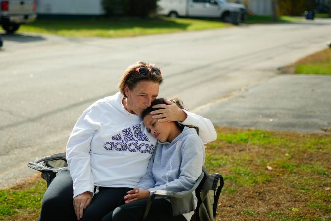 Tammy Asselin, who was at the Schemengees Bar and Grille with her daughter, Toni, during the shooting, embrace during an interview in Lewiston, Maine, on Friday. Tricia Asselin, one of the <a href="index.php?page=&url=https%3A%2F%2Fwww.cnn.com%2F2023%2F10%2F27%2Fus%2Fthese-are-the-victims-of-the-maine-mass-shootings" target="_blank">victims</a> of the shooting, is Tammy's cousin, according to the <a href="index.php?page=&url=https%3A%2F%2Fapnews.com%2Farticle%2Fmaine-shooting-victims-1be7d14e90ef6c91ca23819163d29f3e" target="_blank" target="_blank">Associated Press</a>.