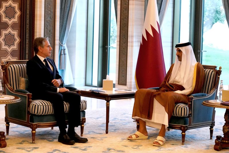 U.S. Secretary of State Antony Blinken and Qatari Emir Sheikh Tamim bin Hamad Al Thani attend a meeting in Lusail, Qatar, Friday Oct. 13, 2023. Jacquelyn Martin/Pool via REUTERS