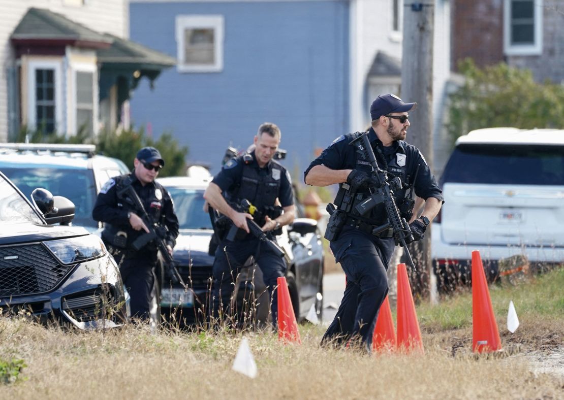 Members of law enforcement arrive at a farm, as the search for the suspect in the deadly mass shootings in Lewiston continues, in Lisbon Falls, Maine, U.S. October 27, 2023. REUTERS/Kevin Lamarque