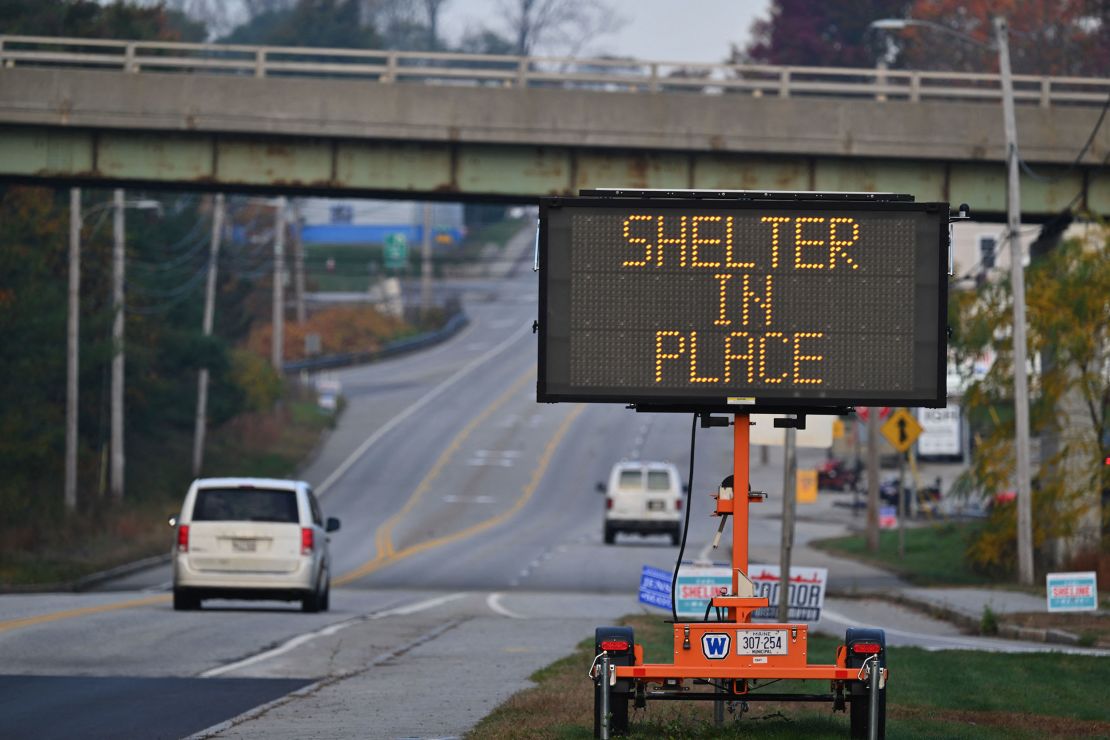 A shelter in place sign is displayed in Lewiston, Maine, on October 27, 2023, in the aftermath of a mass shooting. Hundreds of police in the US state of Maine hunted October 26, 2023 for a fugitive gunman who killed 18 people at a bowling alley and a bar, as President Joe Biden mourned "yet another senseless and tragic mass shooting." Police named the suspect as 40-year-old Robert Card -- seen in surveillance footage pointing a semi-automatic rifle as he walked into the Sparetime Recreation bowling alley. (Photo by ANGELA WEISS / AFP) (Photo by ANGELA WEISS/AFP via Getty Images)