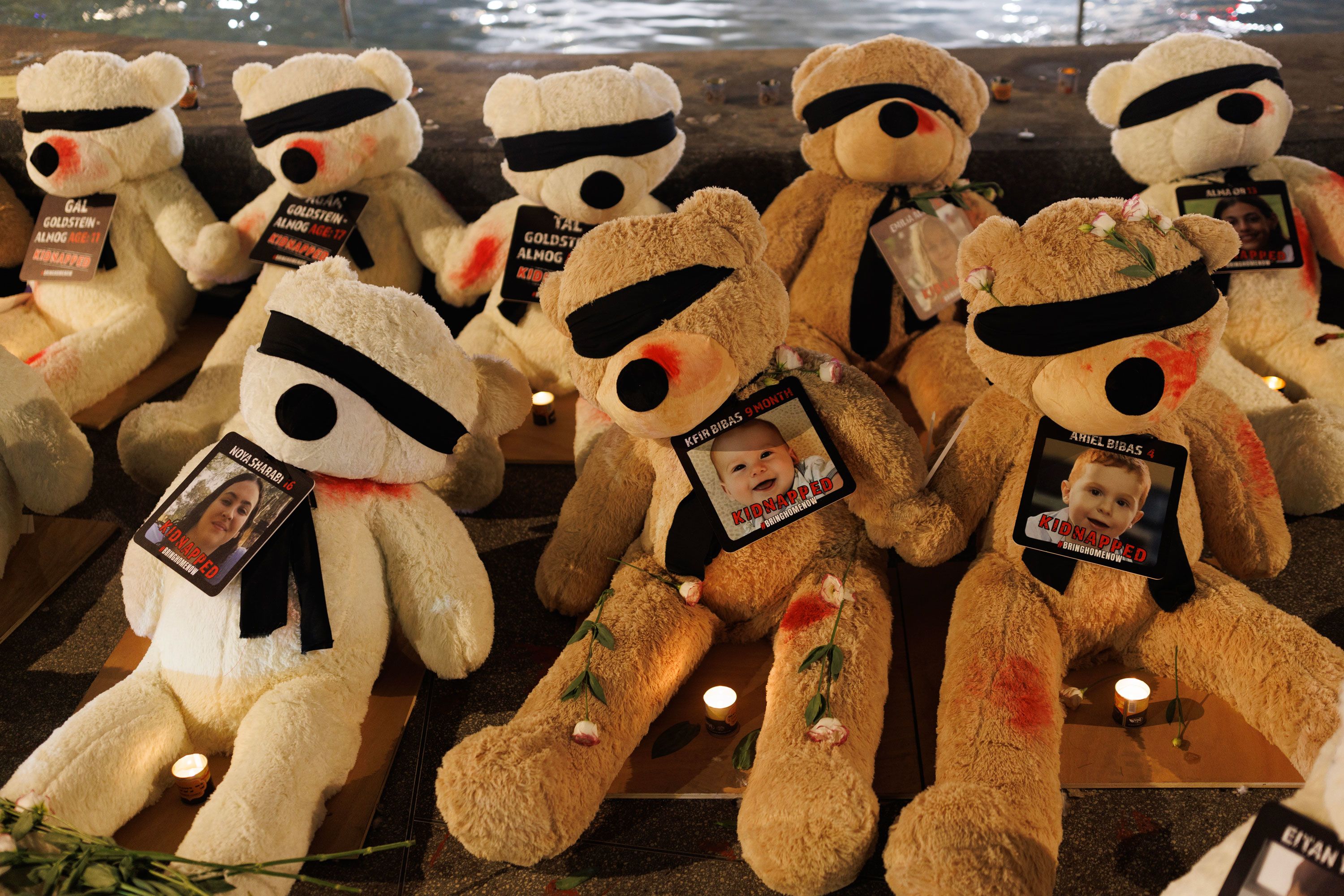Teddy bears with their eyes covered and showing signs of injury are displayed to highlight the young children and babies currently missing, believed to be being held hostage by Hamas, on October 27 in Tel Aviv, Israel.