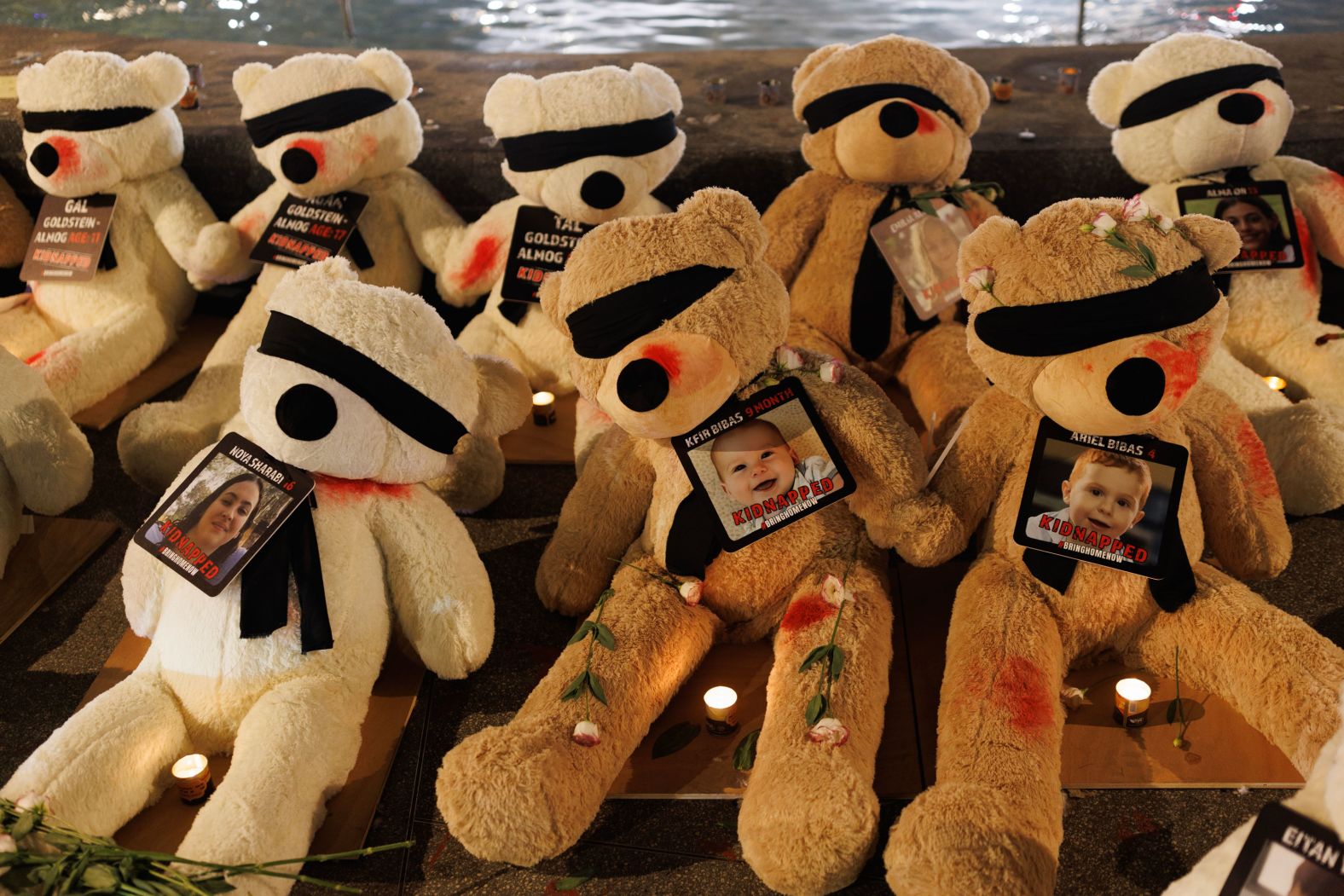 Teddy bears with their eyes covered and showing signs of injury are displayed to highlight the young children and babies currently missing, believed to be being held hostage by Hamas, on October 27 in Tel Aviv, Israel.