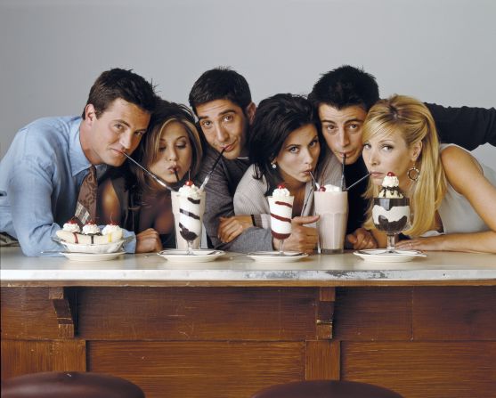 The cast of "Friends" drink milkshakes in an iconic promo photo.
