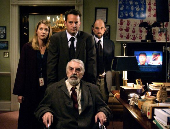 Perry portrayed Joe Quincy on "The West Wing" in 2003, seen here alongside Amy Stewart, Richard Schiff and Milo O'Shea.