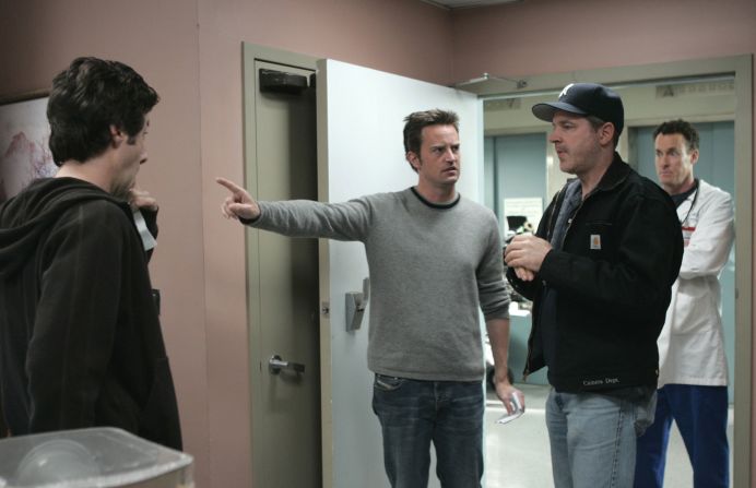 Perry made his directorial debut in a 2004 episode of "Scrubs." He is seen here talking to director of photography John Inwood as actors Zach Braff, left, and John C. McGinley look on.
