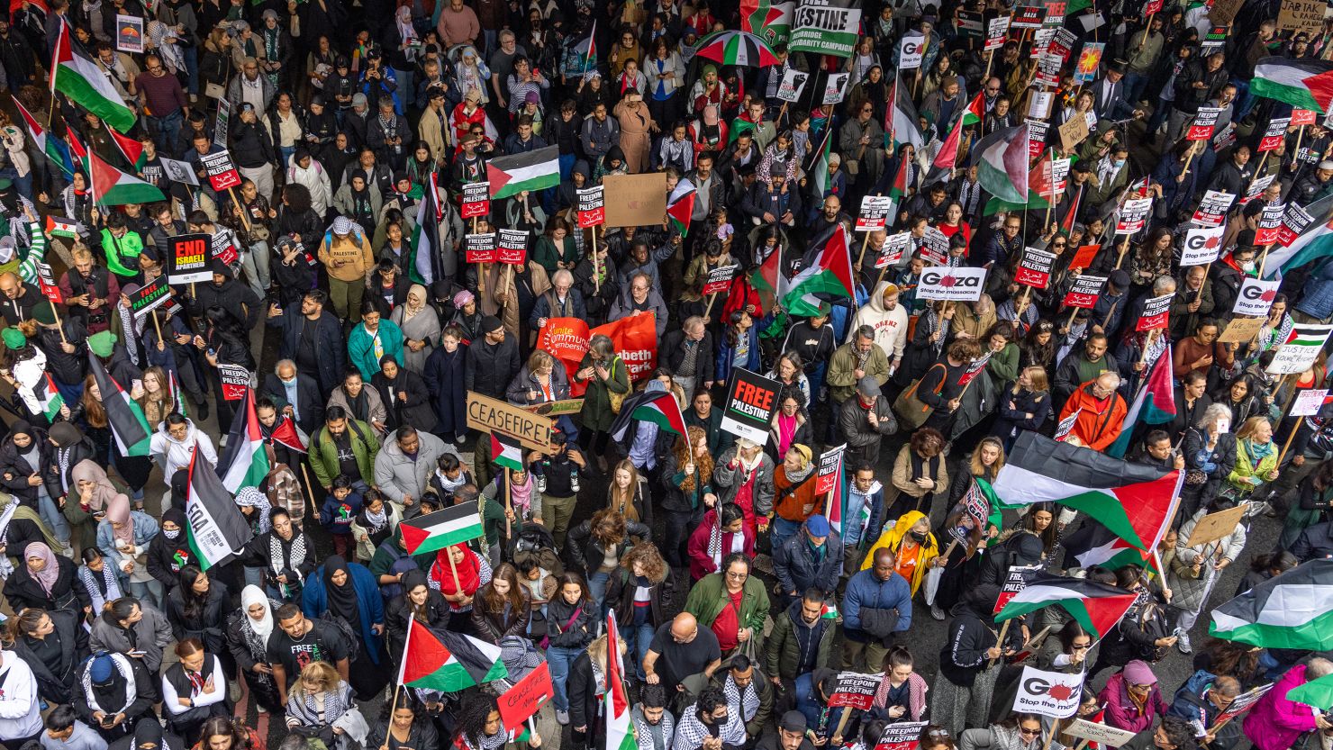 LONDON, UNITED KINGDOM - 2023/10/28: Tens of thousands of pro-Palestinian protesters march on the street during the demonstration urging an end to Israel's attacks in Gaza. Thousands have marched in support of Palestine demanding a ceasefire as Israeli forces continue to bombard Gaza. Israel's offensive is in response to Hamas's attack on Israel which resulted in some 1400 deaths. The death toll from Israeli attacks on densely-populated Gaza has already risen above 7000, with many civilians and children among the victims. (Photo by Phil Lewis/SOPA Images/LightRocket via Getty Images)