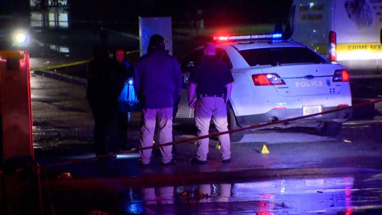Police arrive on the scene of a shooting at a Halloween party in Indianapolis.