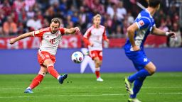 Bayern's Harry Kane scores his side's fifth goal during the German Bundesliga soccer match between Bayern Munich and SV Darmstadt 98 at the Allianz Arena in Munich, Germany, Saturday, Oct. 28, 2023. (Tom Weller/dpa via AP)