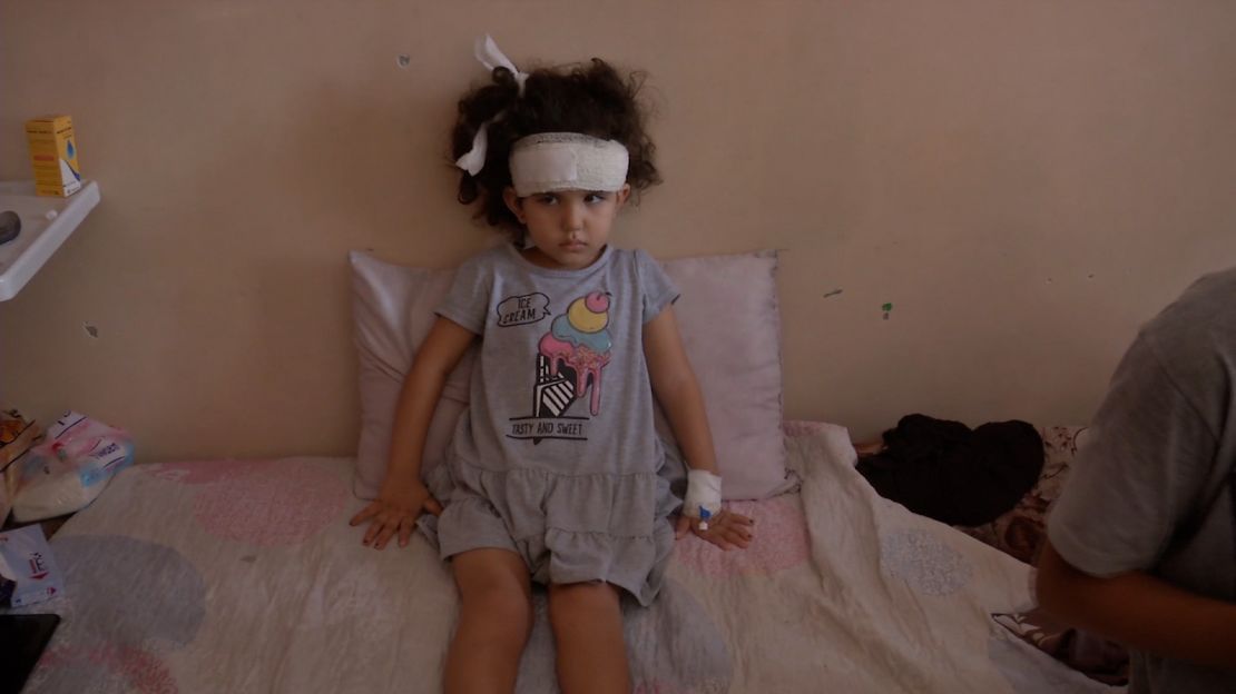 Joudi, 3, pictured in al-Shifa Hospital in Gaza City, was injured by Israeli strikes when her family were fleeing their home in in northern Gaza. Her father told CNN she hasn't spoken in weeks, because she is still in shock.