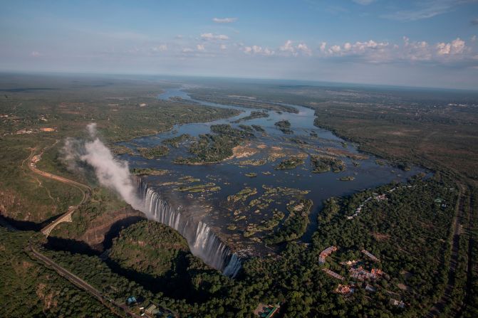 <strong>Victoria Falls, Zambia/Zimbabwe --</strong> At <a href="index.php?page=&url=https%3A%2F%2Fwww.lionworldtravel.com%2Fnews%2Fvictoria-falls-funfacts-mosi-oa-tunya" target="_blank" target="_blank">Mosi-oa-Tunya</a>, or Victoria Falls, every minute 500 million liters (132 million gallons) of water plummet 108 meters (354 feet) down a series of gorges. Located on the Zambezi River, mist from these falls can be seen more than 20 kilometers (12 miles) away. Mosi-oa-Tunya, the waterfall's name in Sotho, translates as "The smoke that thunders." 