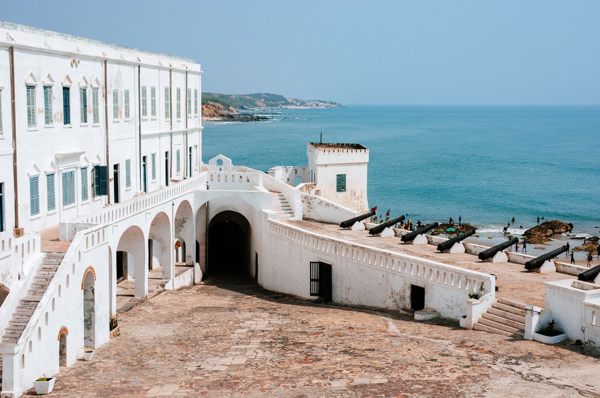 <strong>Cape Coast Castle, Ghana -- </strong>Cape Coast Castle in Ghana forms part of the Forts and Castles of Ghana UNESCO site that lines the country's coastline. This <a href="https://visitghana.com/attractions/cape-coast-castle/" target="_blank" target="_blank">fortification</a> was named so in 1664 by the British and served as the seat of British administration in present-day Ghana. The castle serves as a reminder of the dark history of the transatlantic slave trade, in which it played a critical role.