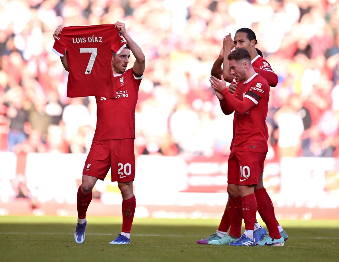 LIVERPOOL, ENGLAND - OCTOBER 29: (THE SUN OUT, THE SUN ON SUNDAY OUT) Diogo Jota of Liverpool celebrates after scoring the opening goal by holding a Luis Diaz shirt during the Premier League match between Liverpool FC and Nottingham Forest at Anfield on October 29, 2023 in Liverpool, England. (Photo by Andrew Powell/Liverpool FC via Getty Images)