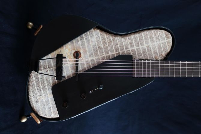 Rosenkrantz described the "Mycocaster" as having a surprisingly twangy and nasal sound, but says it can be calibrated to the player's liking. The shell and neck are made from compressed paper in resin, and scraps of upcycled wood are used on the shallow sides.<br />