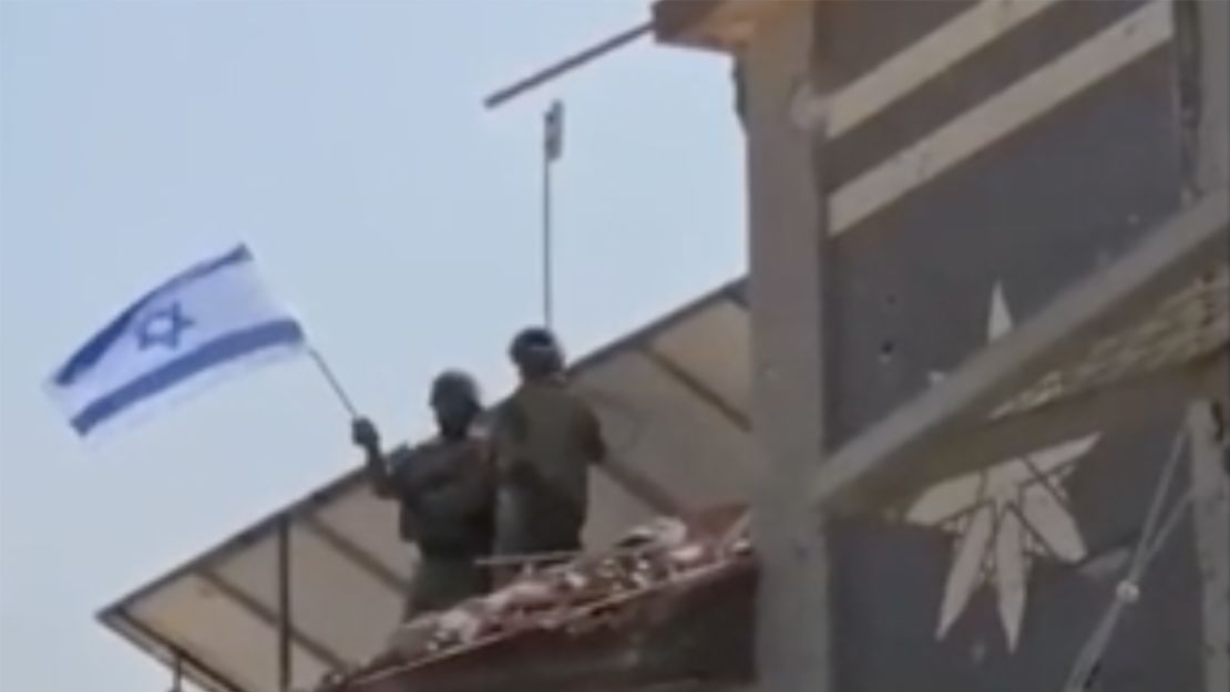 Israeli troops flag in Gaza