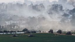 Israeli tanks and other military vehicles manoeuvre inside Gaza, as seen from Israel, on October 29, 2023.
