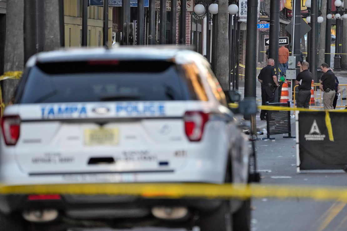 Tampa police officers stand in the street in the Ybor City of Tampa after a shooting Sunday, October 29, 2023.