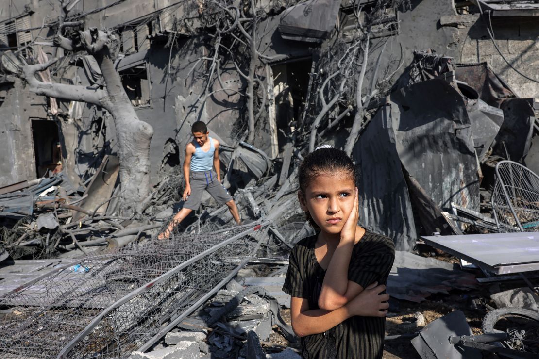 A girl looks on as she stands by the rubble outside a building that was hit by Israeli bombardment in Rafah in the southern Gaza Strip on October 31, 2023 amid ongoing battles between Israel and the Palestinian Hamas movement. (Photo by MOHAMMED ABED / AFP) (Photo by MOHAMMED ABED/AFP via Getty Images)