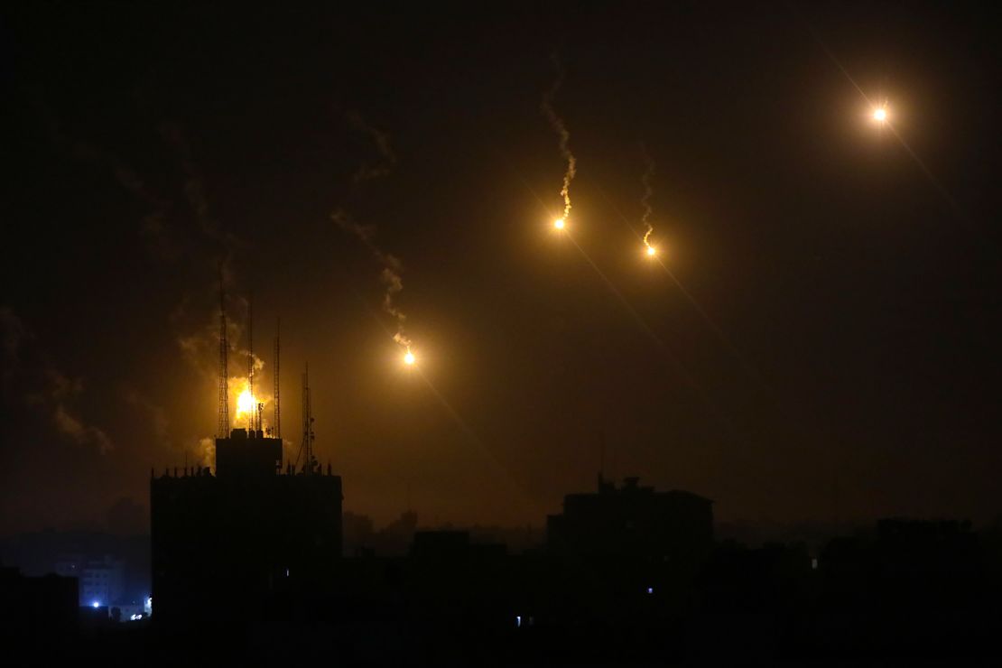 Israeli military flares light up the night sky in northern Gaza on October 30, 2023.