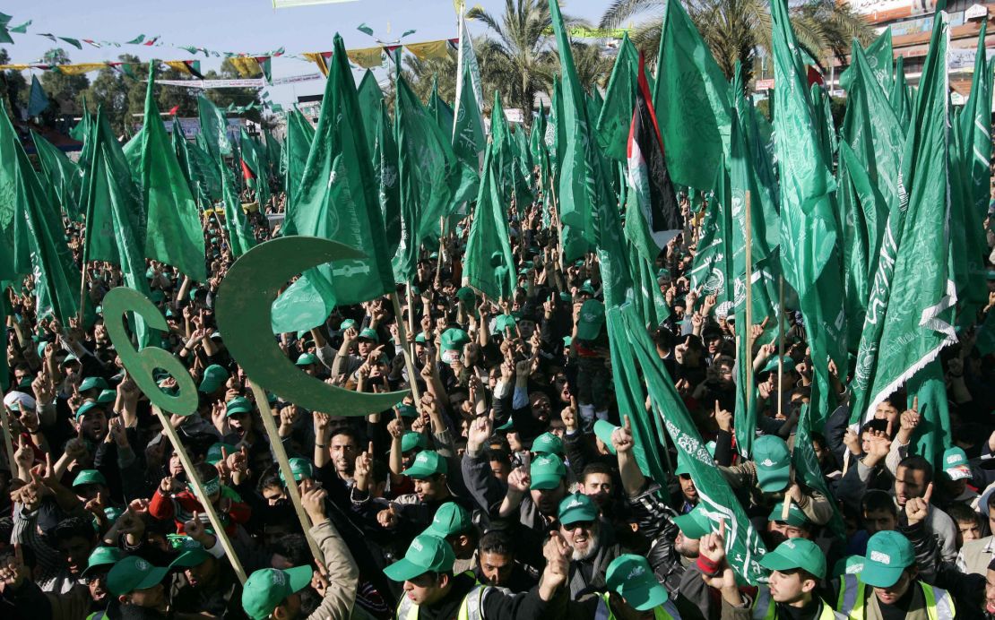 GAZA CITY, -:  Hamas supporters, carrying the Islamist movement's green flags, take part in an election campaign rally in Gaza City 20 January 2006, ahead of the January 25 Palestinian parliamentary elections. Israeli President Moshe Katsav said in an interview published today that talks with Hamas could one day be possible if the radical Islamic group abandoned its goal of destroying the Jewish state.  AFP PHOTO/MOHAMMED ABED  (Photo credit should read MOHAMMED ABED/AFP via Getty Images)