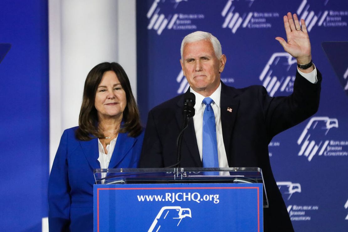 Former vice president Mike Pence announces the end of his presidential campaign, alongside his wife Karen Pence, at the annual Republican Jewish Coalition leadership meeting at the Venetian on Saturday, October 28, 2023, in Las Vegas.