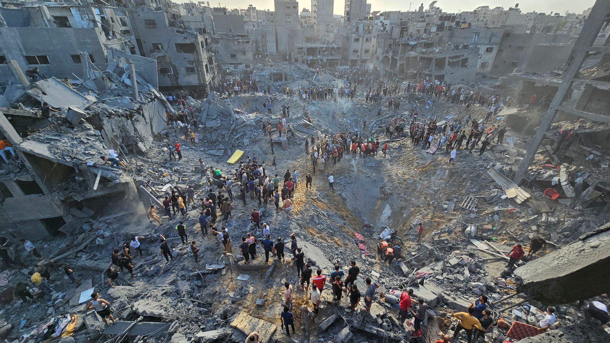 Palestinians search for casualties at the site of Israeli strikes on Jabalya refugee camp in northern Gaza on October 31. 