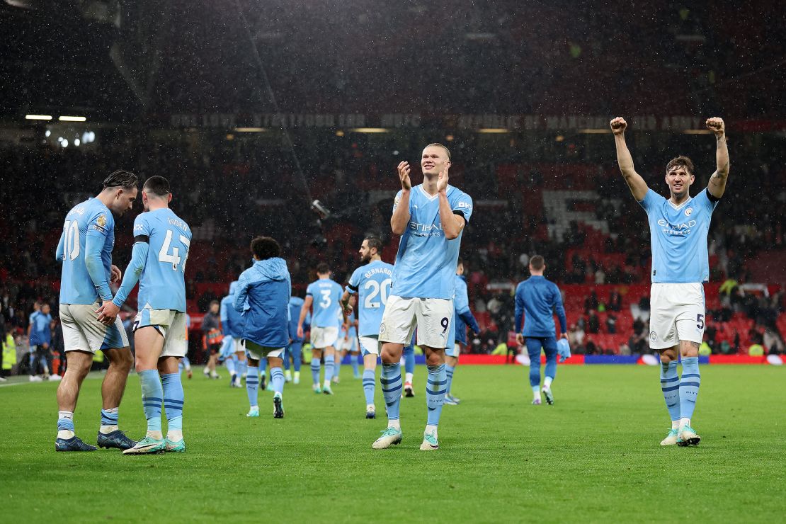 MANCHESTER, ENGLAND - OCTOBER 29: Erling Haaland and John Stones of Manchester City celebrate after the team's victory in the Premier League match between Manchester United and Manchester City at Old Trafford on October 29, 2023 in Manchester, England. (Photo by Catherine Ivill/Getty Images)
