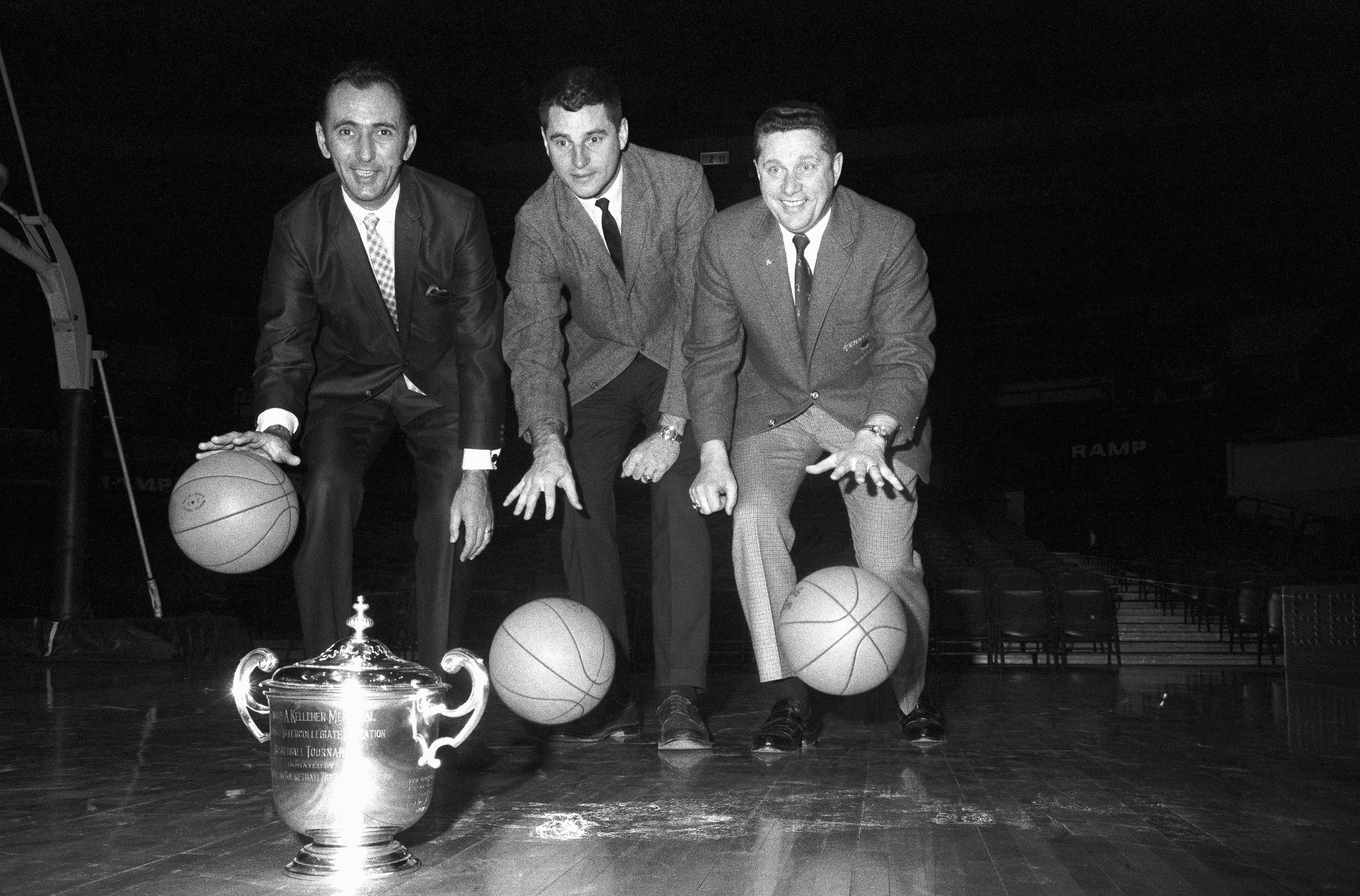 Knight is photographed with Boston College coach Bob Cousy and Tennessee coach Ray Mears ahead of the National Invitation Tournament in 1969.