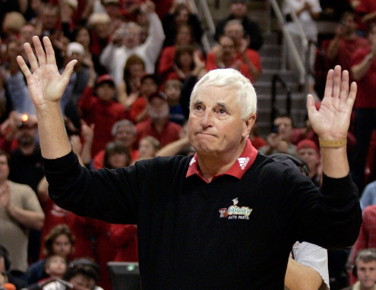 Knight, who coached at Texas Tech from 2001 to 2008, gestures to the crowd after his team defeated the New Mexico Lobos to give Knight 880 wins in 2007.