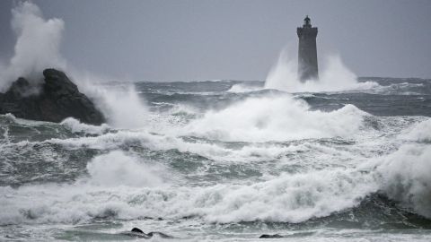This photograph shows waves crashing on the "Phare du Four" (Four's lighthouse) in Porspoder, western France, on November 2, 2023, as the storm Ciaran hits the region. Much of northwestern Europe went on high alert on November 1, 2023 as a storm dubbed Ciaran threatened to bring gale-force winds and extreme rainfall to the region. (Photo by DAMIEN MEYER / AFP) (Photo by DAMIEN MEYER/AFP via Getty Images)