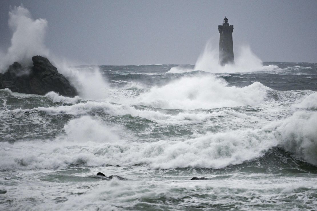 This photograph shows waves crashing on the "Phare du Four" (Four's lighthouse) in Porspoder, western France, on November 2, 2023, as the storm Ciaran hits the region. Much of northwestern Europe went on high alert on November 1, 2023 as a storm dubbed Ciaran threatened to bring gale-force winds and extreme rainfall to the region. (Photo by DAMIEN MEYER / AFP) (Photo by DAMIEN MEYER/AFP via Getty Images)
