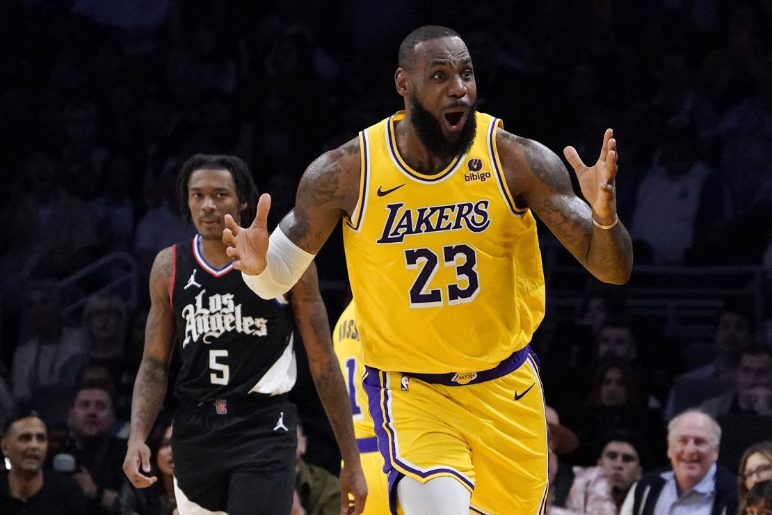 Los Angeles Lakers forward LeBron James, right, reacts after being called for goal tending as Los Angeles Lakers forward Cam Reddish looks on during the second half of an NBA basketball game Wednesday, Nov. 1, 2023, in Los Angeles. (AP Photo/Mark J. Terrill)