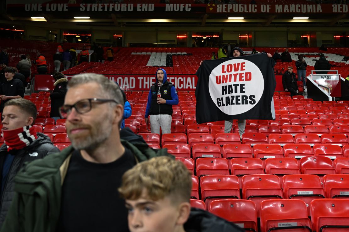 MANCHESTER, ENGLAND - NOVEMBER 01: A Manchedster United fan holds an anti Glazer banner during the Carabao Cup Fourth Round match between Manchester United and Newcastle United at Old Trafford on November 01, 2023 in Manchester, England. (Photo by Michael Regan/Getty Images)