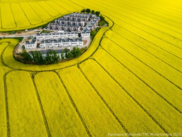 Agnieszka Wieczorek won the aerials category with this drone shot of a small Polish village in the middle of yellow rapeseed fields. 