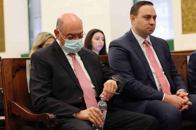 Former Trump Organization Executive Allen Weisselberg, left, sits in the courtroom during during the trial on October 10.