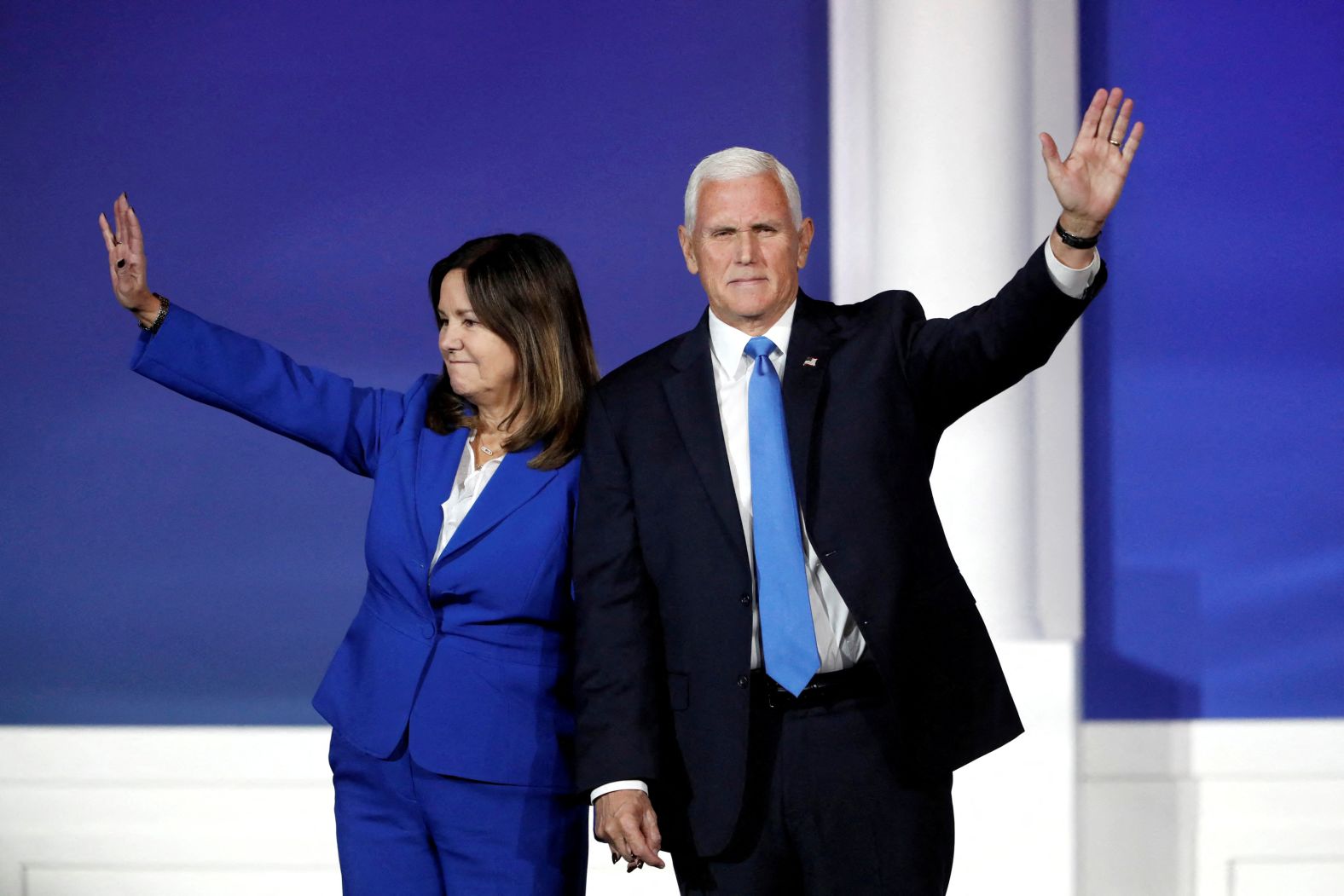 Former US Vice President Mike Pence waves with his wife, Karen, as he leaves the stage after announcing he is <a href="https://www.cnn.com/2023/10/28/politics/pence-suspends-white-house-bid/index.html" target="_blank">suspending his presidential campaign</a> during the Republican Jewish Coalition Annual Leadership Summit in Las Vegas on Saturday, October 28.