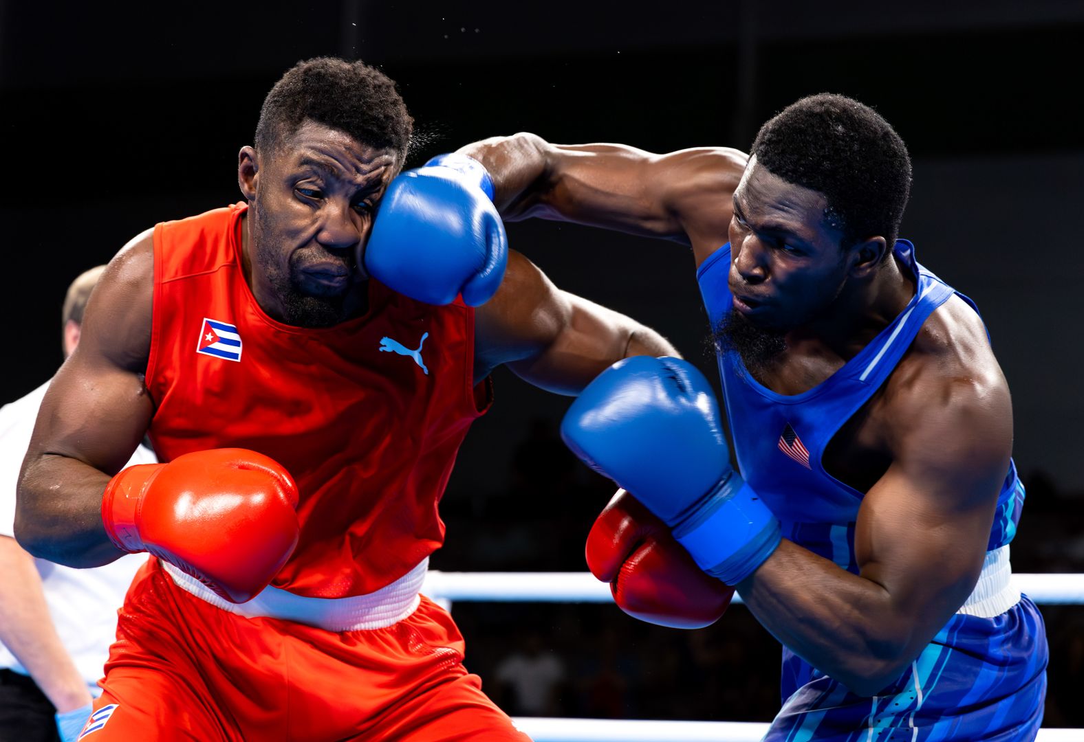 Joshua Edwards of the United States, right, punches Cuba's Fernando Alejandro Arzola at the Pan American Games in Santiago, Chile, on Thursday, October 26.