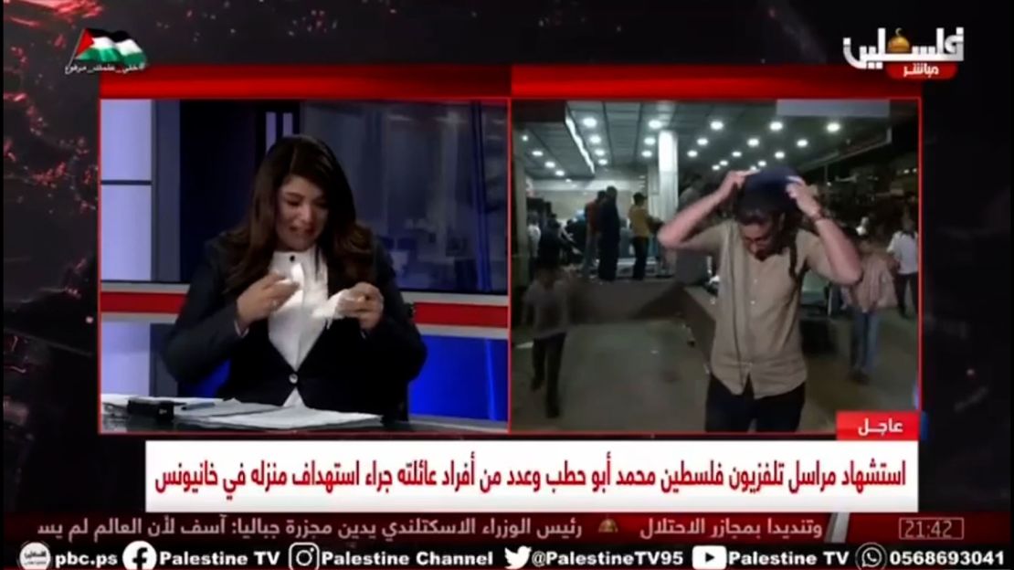 Palestine TV journalist Salman Al Bashir takes off his vest and helmet while giving an emotional on-air report on Thursday after the death of fellow Palestine TV correspondent, Mohammad Abu Hattab, in Gaza.