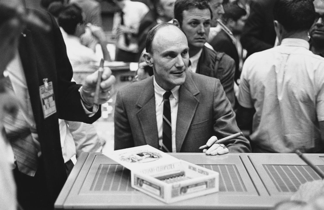 Astronaut Thomas Kenneth 'Ken' Mattingly II celebrates the successful rescue of the Apollo 13 spacecraft and crew with a box of cigars at the Mission Control of the Manned Spacecraft Center in Houston, Texas, following the aborted lunar landing mission, 17th April 1970. Mattingly was to have been a prime crew member of Apollo 13, but was replaced by Jack Swigert three days before launch due to health concerns.  (Photo by Space Frontiers/Getty Images)