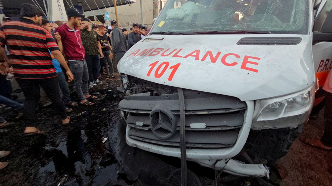 Palestinians check the damage on an ambulance after a convoy of ambulances was hit, at the entrance of Shifa hospital in Gaza City, November 3, 2023. REUTERS/Anas al-Shareef